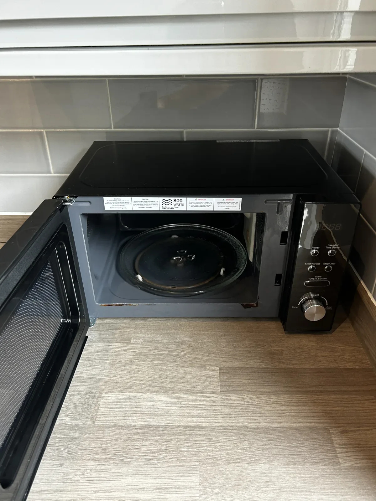 Microwave interior after end of tenancy clean, seven dials