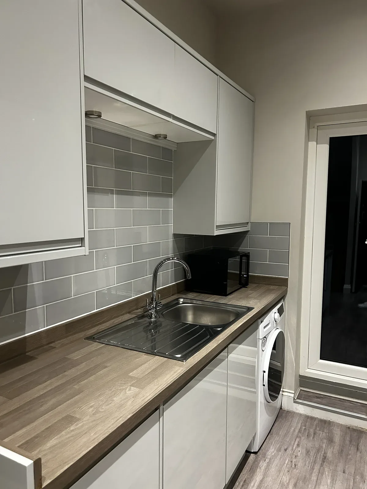 Kitchen sink and worktop after clean, seven dials
