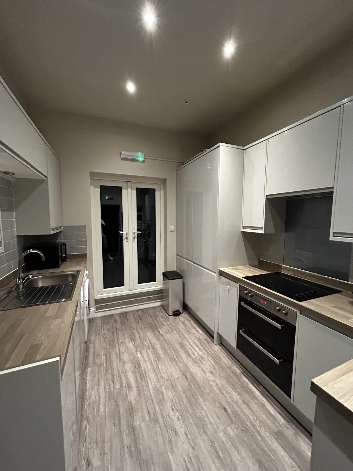 Open plan kitchen evening after clean, seven dials