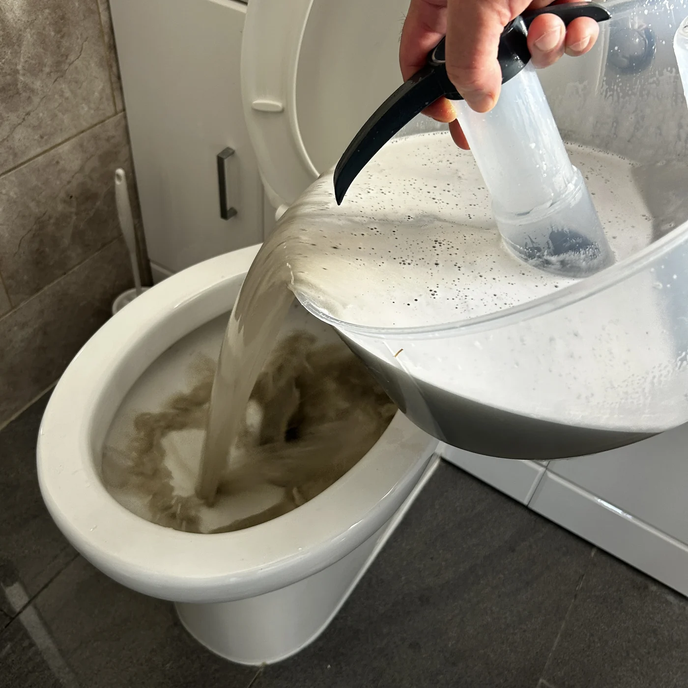 Toilet being cleaned during a deep clean, Thornton Heath, Croydon